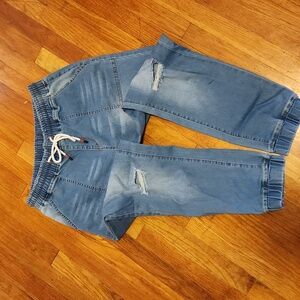Distressed Denim joggers with elastic and tie waistband. Unknown brand